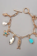 CHARM TOGGLE BRACELET-FISH CROSS CONCH PEARL | GOLD