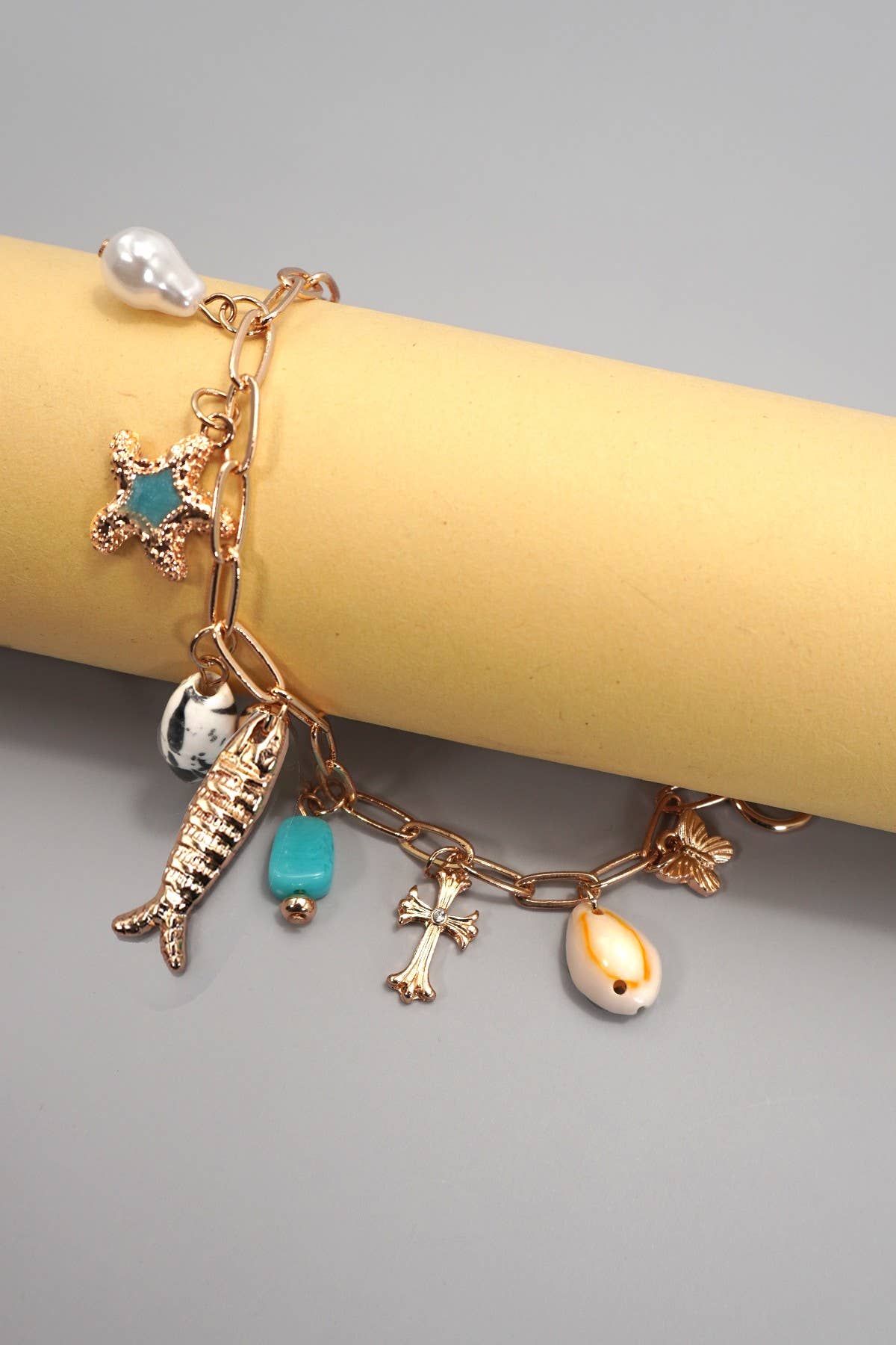 CHARM TOGGLE BRACELET-FISH CROSS CONCH PEARL | GOLD